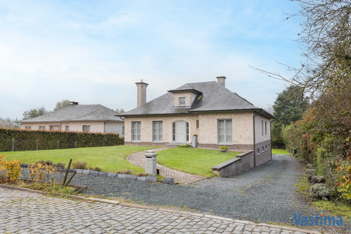 Immo Vastima - Huis Te koop Meldert - Stijlvolle villa met royale woonruimtes aan Kravaalbos