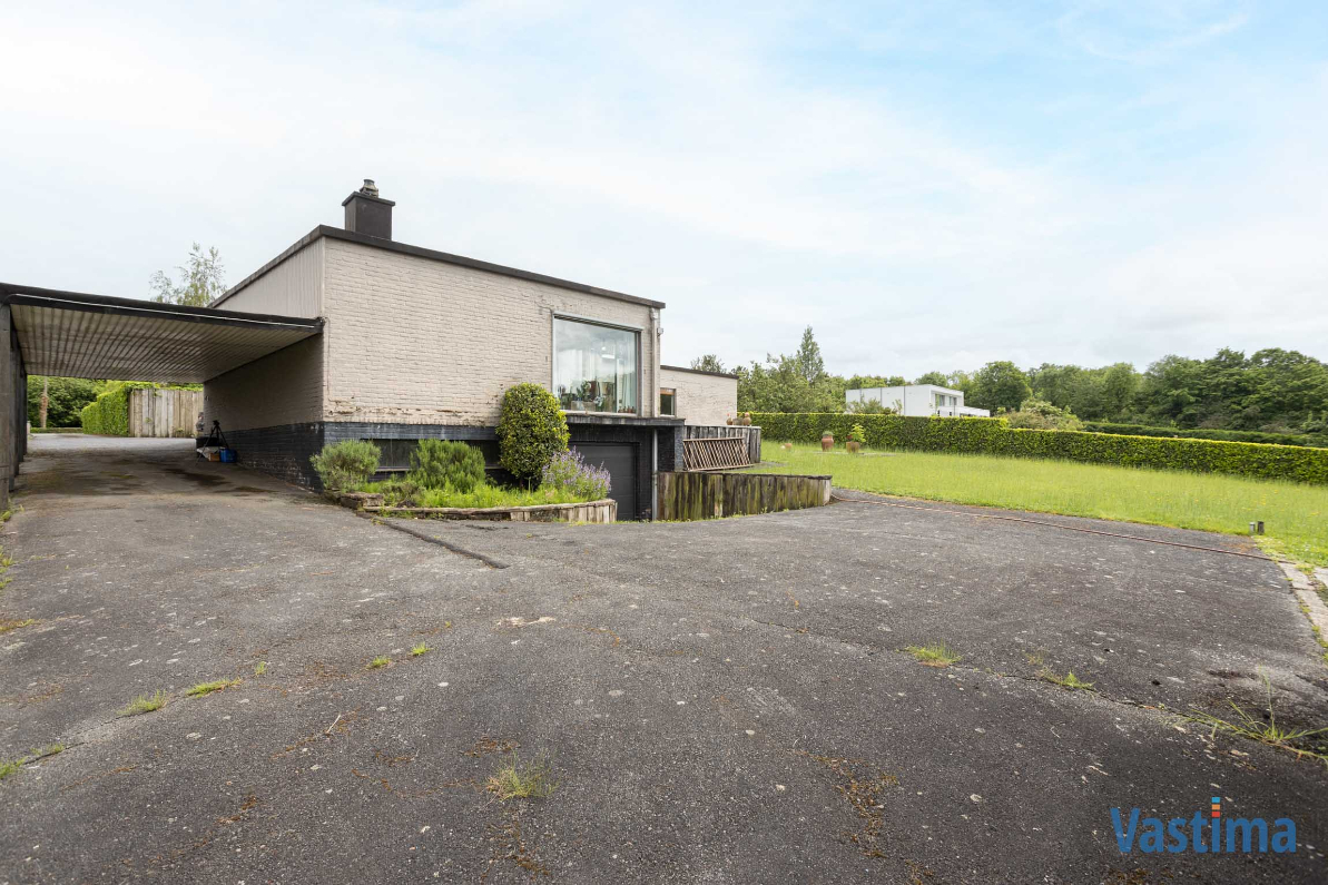 Immo Vastima - Huis Te koop Asse - Modernistische Villa met zwembad in een oase van groen