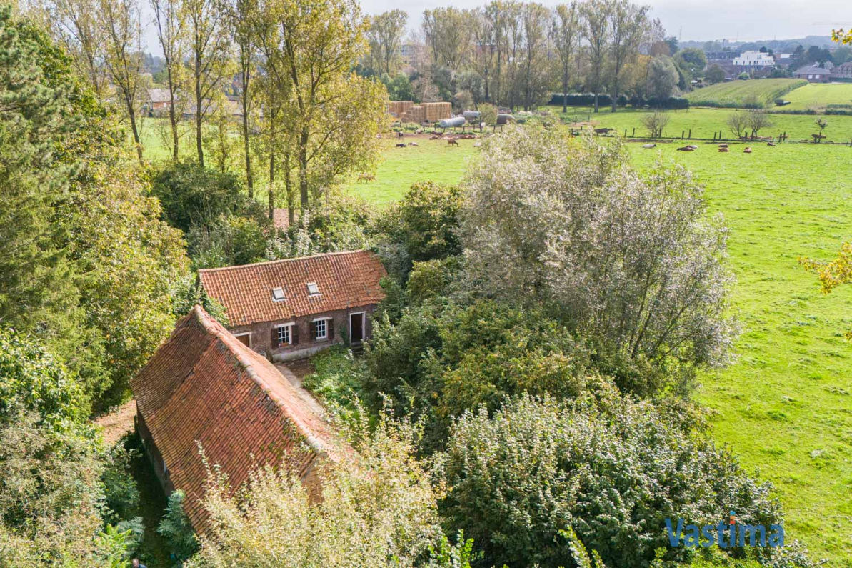 Immo Vastima - Huis Te koop Opwijk - Charmant hoevetje met schuur in een groene oase