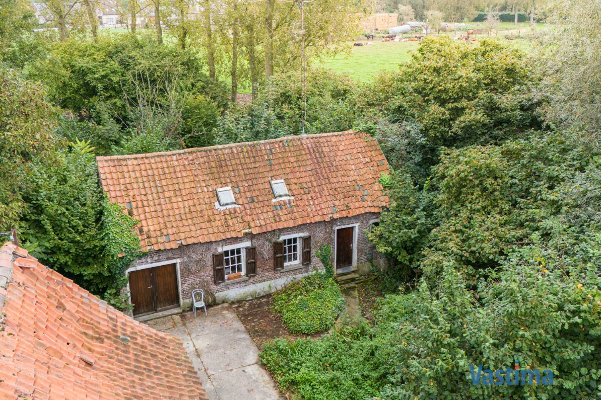 Immo Vastima - Huis Te koop Opwijk - Charmant hoevetje met schuur in een groene oase