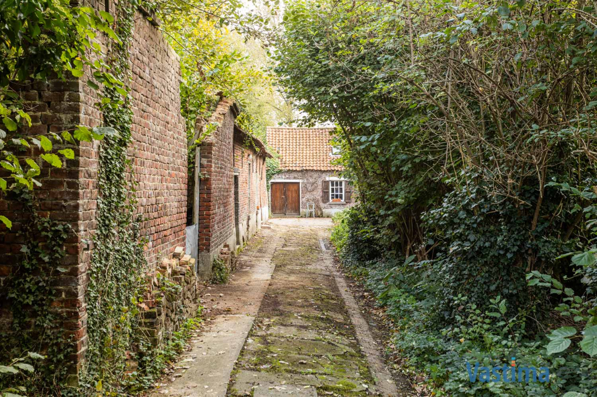 Immo Vastima - Huis Te koop Opwijk - Charmant hoevetje met schuur in een groene oase