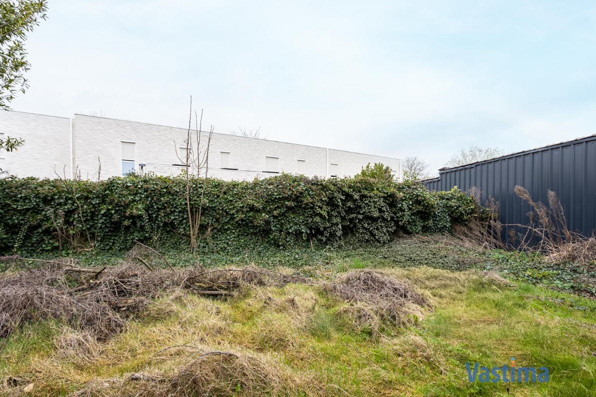 Immo Vastima - Grond Te koop Merchtem - Unieke grond in het hart van Merchtem