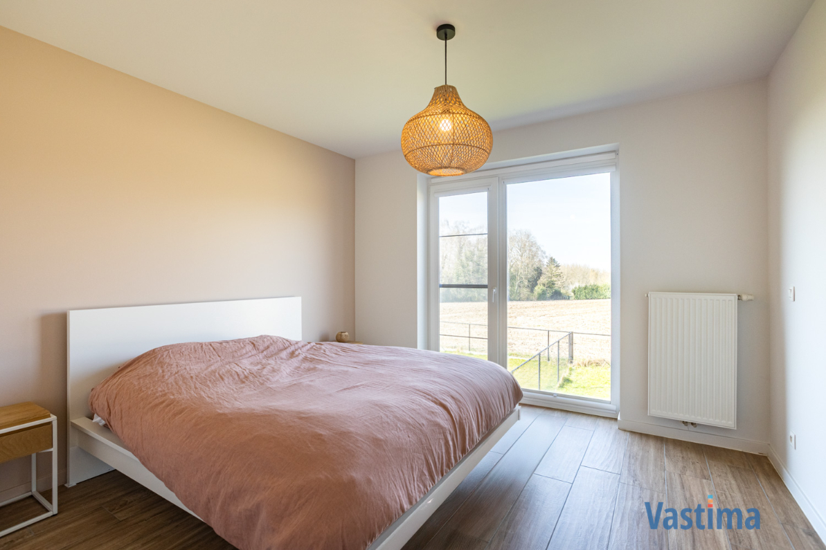 Immo Vastima - Appartement Te koop Bambrugge - Energiezuinig appartement met 2 slaapkamers, terras en zicht op groen