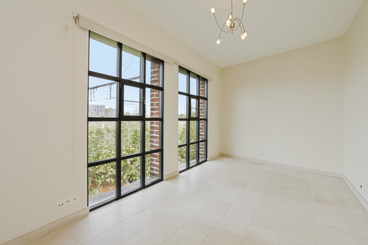 Immo Vastima - Appartement Te koop Aalst - Stijlvol appartement in iconisch gebouw met ruim terras in hartje Aalst