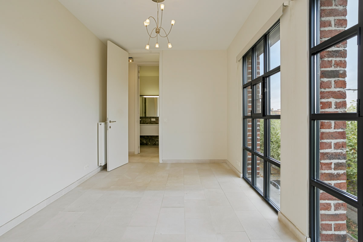 Immo Vastima - Appartement Te koop Aalst - Stijlvol appartement in iconisch gebouw met ruim terras in hartje Aalst