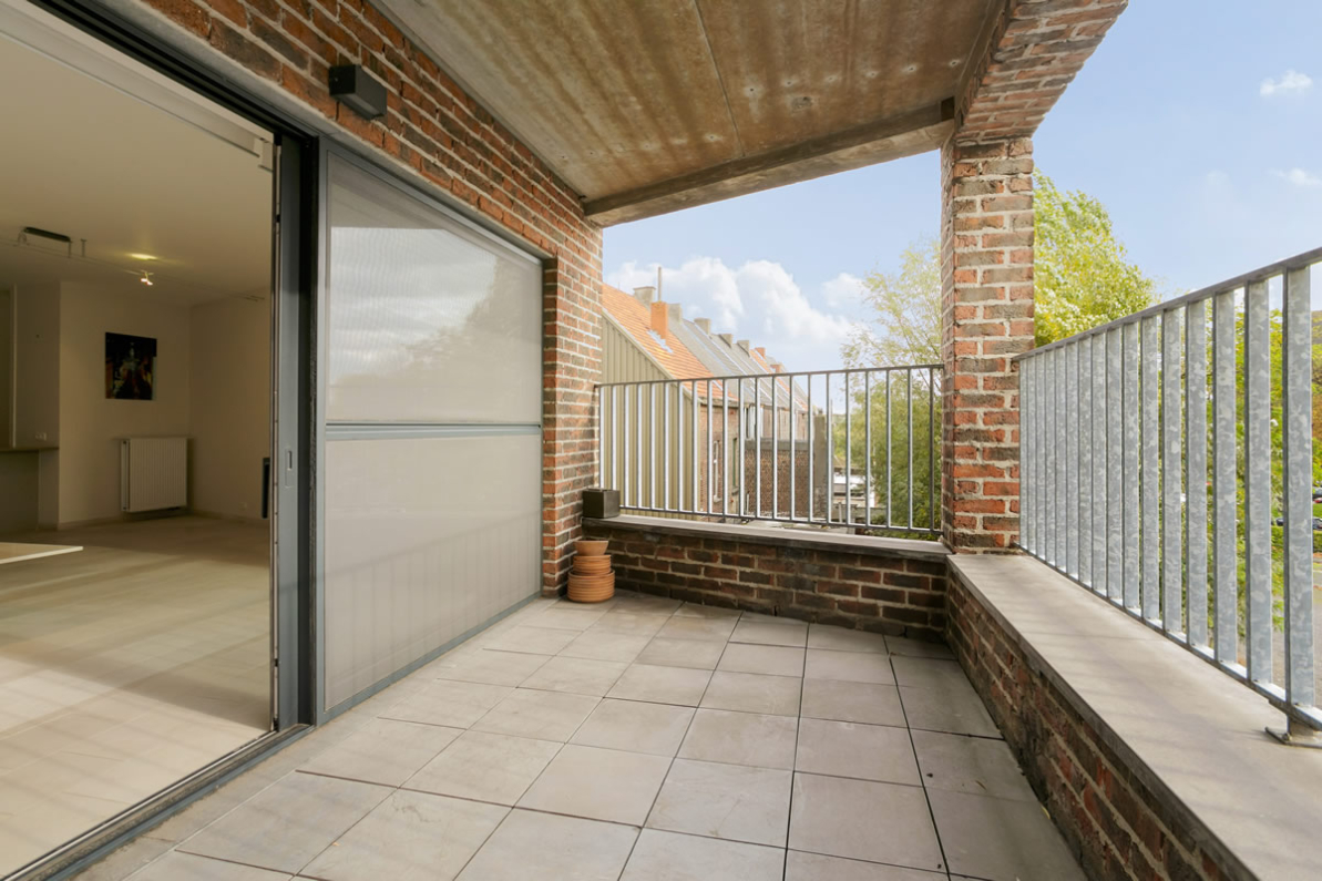 Immo Vastima - Appartement Te koop Aalst - Stijlvol appartement in iconisch gebouw met ruim terras in hartje Aalst