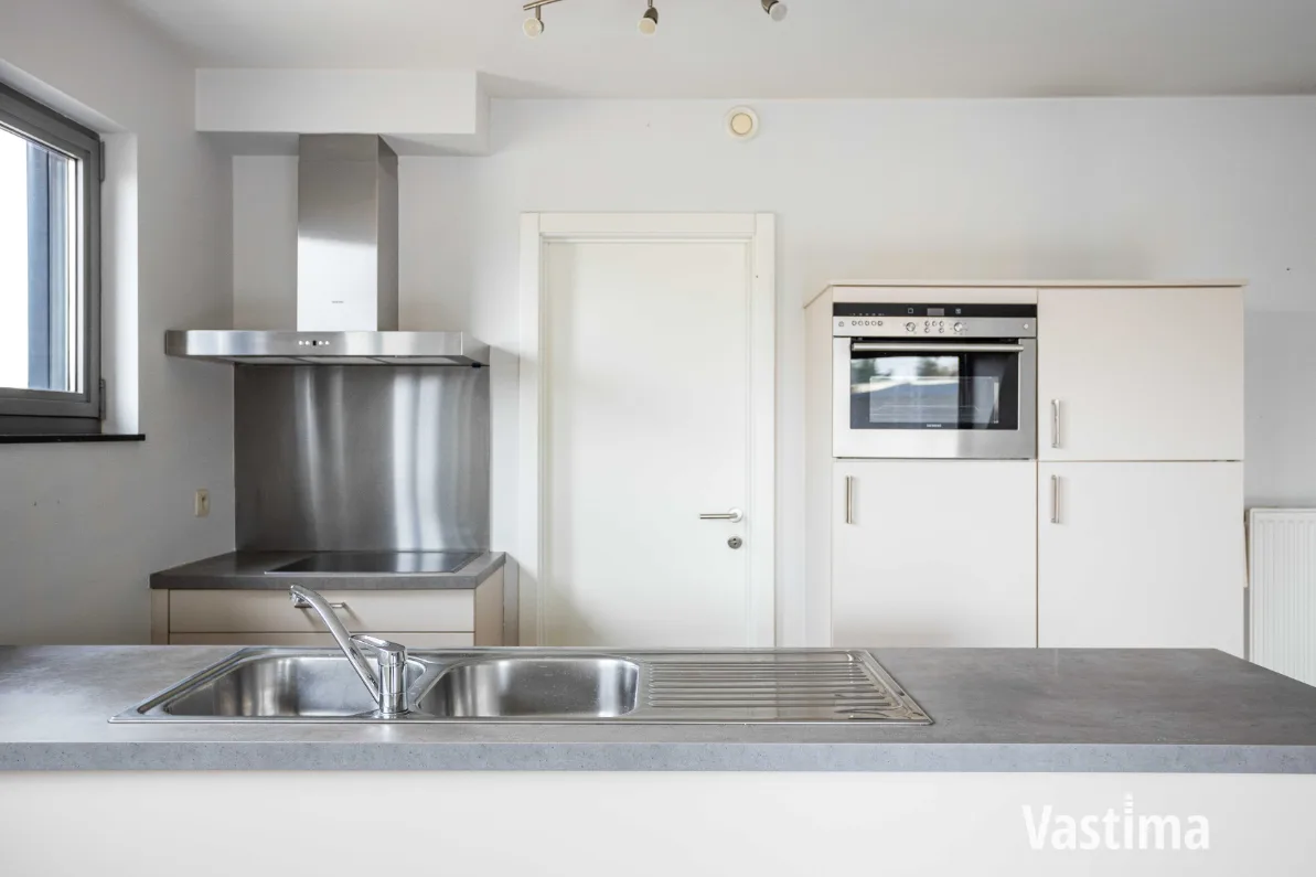 Immo Vastima - Appartement Te koop Aalst - Instapklaar 2-slaapkamerappartement met zuidgericht terras én garage