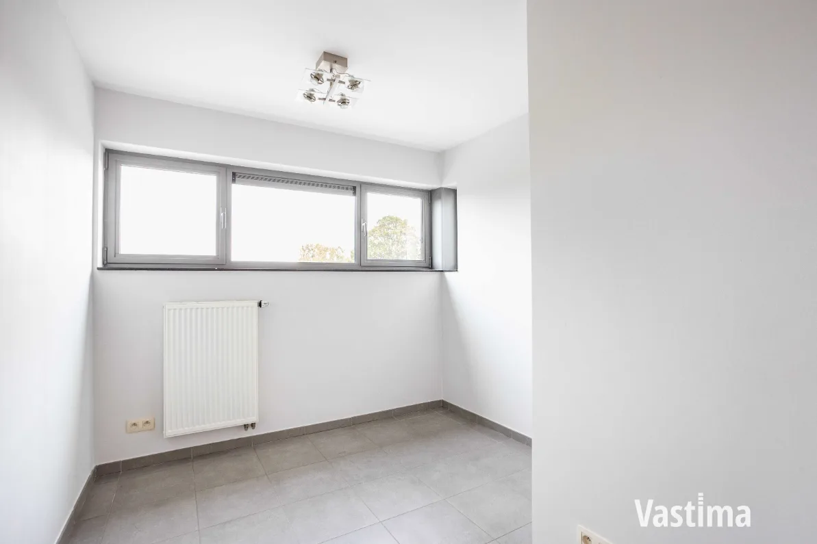 Immo Vastima - Appartement Te koop Aalst - Instapklaar 2-slaapkamerappartement met zuidgericht terras én garage